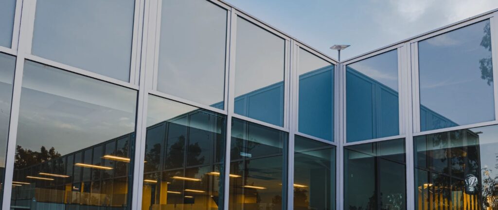 Modern glass-fronted business premises at dusk